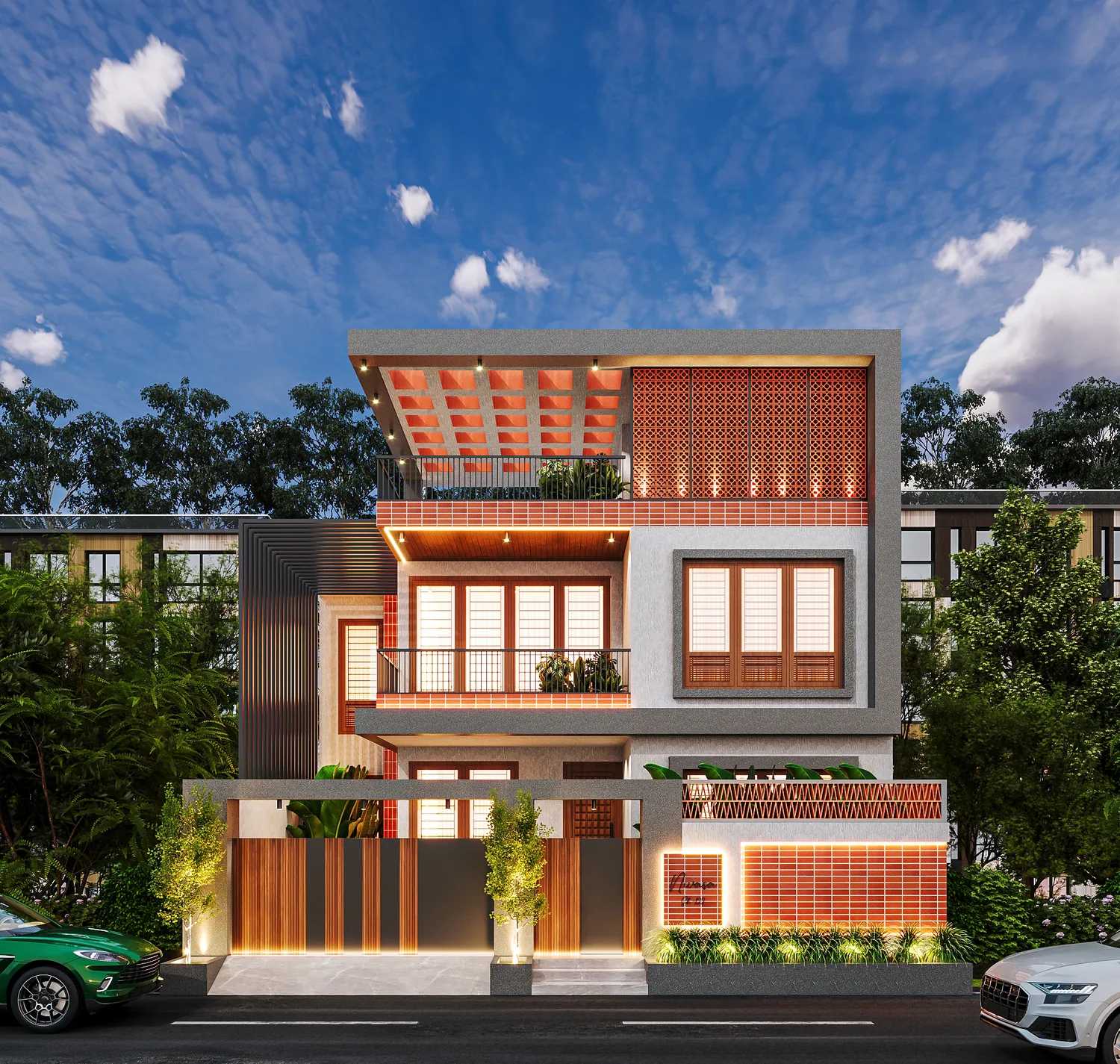 A three-storey UrbanKriti house at dusk: terracotta jaali screens, a coffered terrace canopy and timber-framed windows lit warm against a blue sky